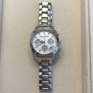 Silver tone Michael kors watch.
